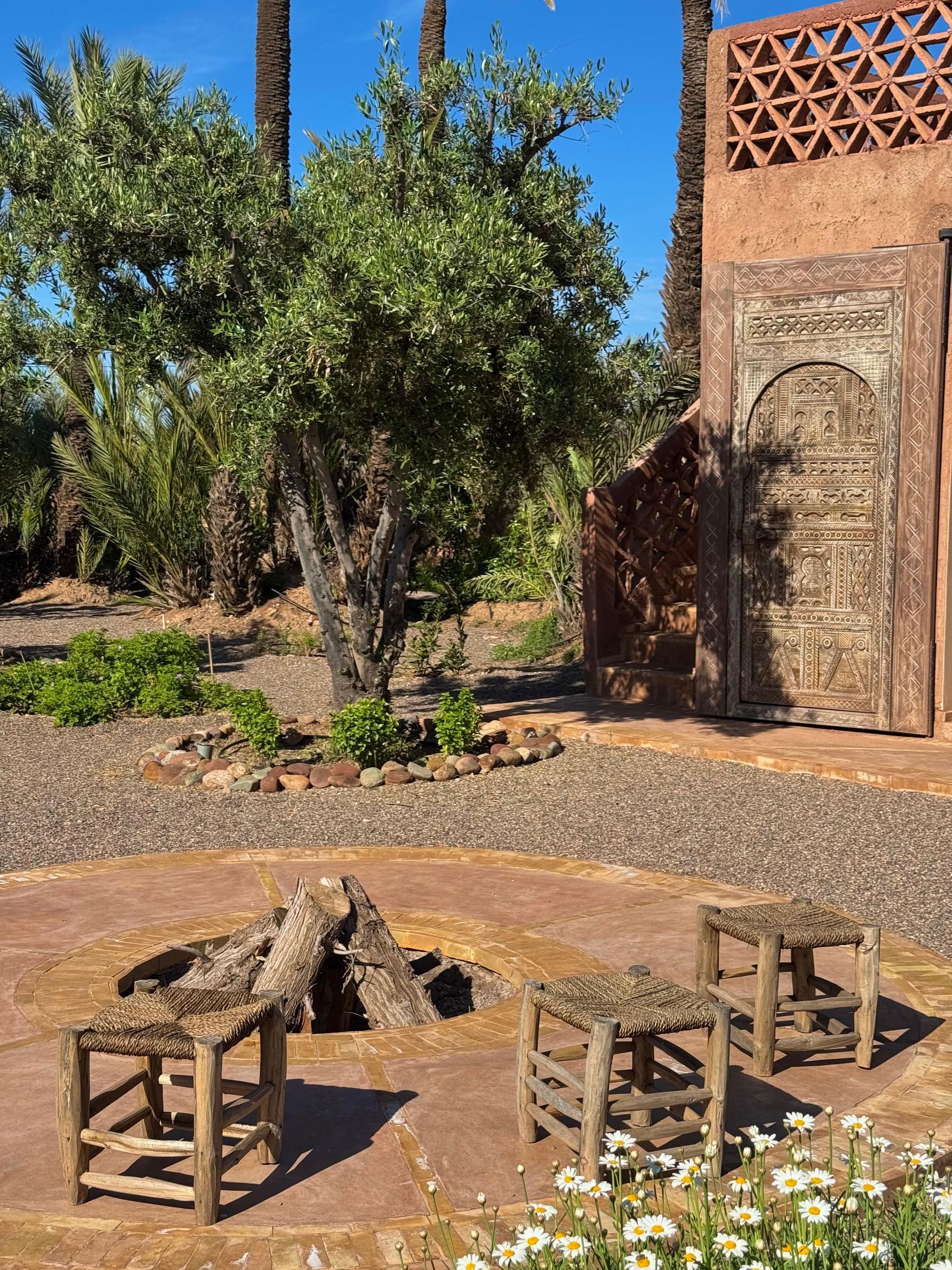 The fire pit and a carved door